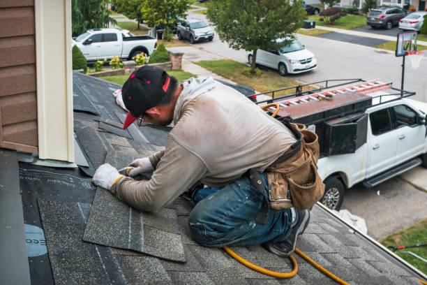 Professional Hail Damage Roof Repair technician working in Evans, WA